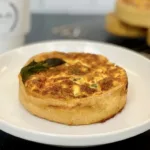 Small, personal-sized French quiche on a white plate